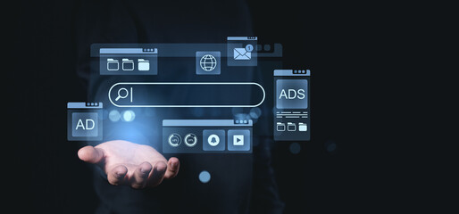 Technology concept with search bar and icons on a hand.