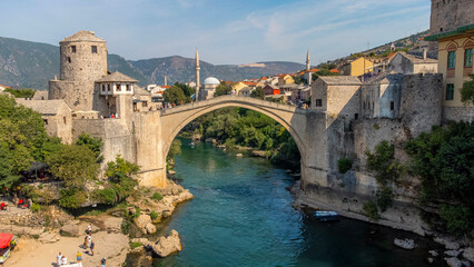 Aerial view of the Old Bridge of Mostar. Stari Most with city background on a sunny day