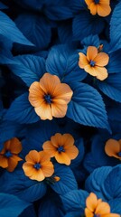 Orange flowers blooming among blue leaves in a vibrant garden setting during springtime