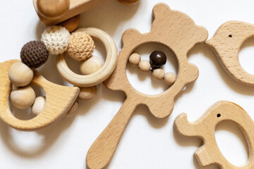 Organic baby teethers on white background. Wooden animal toys set for babies. set of wooden toys isolated on white background.