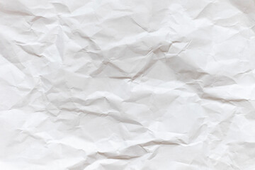 A sheet of white crumpled paper. Abstract background