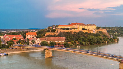 Close-up aerial view of Petrovaradin fortress and Danube river bridge in Novi Sad Serbia at sunset