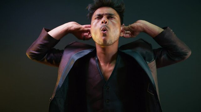 Man tighten his face bothered by noise