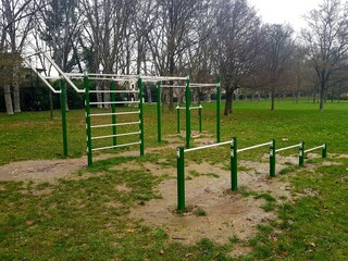 Playground for children in the park on a cloudy winter day.