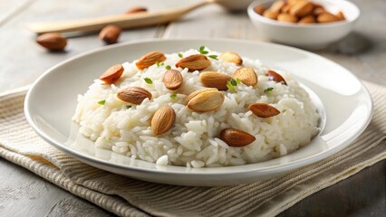 Creamy rice dish topped with toasted almonds on a white plate, food, cuisine, gourmet, delicious, meal, cooking, homemade, rice
