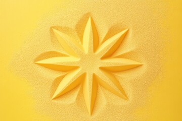 Yellow eight pointed star impression in fine grain sand