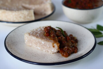 Paputtu or Paal Puttu made with matta rice, a Kerala brown rice, served with chickpea or Kadala masala curry.
