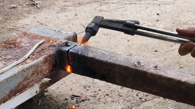A metalworker demonstrates welding and cutting showcasing skills