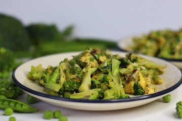 Scrambled eggs with green peas and broccoli