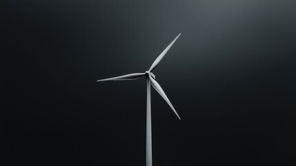 Fototapeta premium Wind turbine stands isolated against a dark overcast sky, symbolizing clean renewable energy and sustainable power generation.