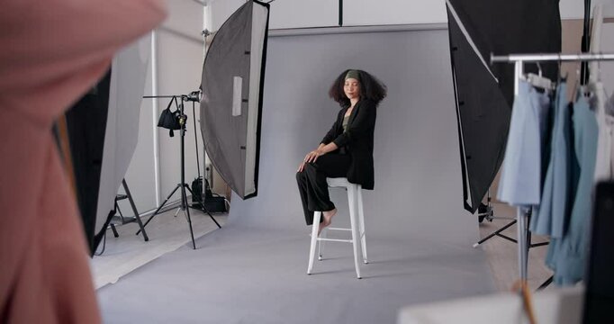Woman, model and camera in studio for photography, photoshoot and fashion production. Photographer, girl and technology in media agency for shooting, videography and brand advertising with light