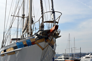 Sailing boat with masts under renovation in Aganlar Marina and shipyard located in Bodrum, the most...
