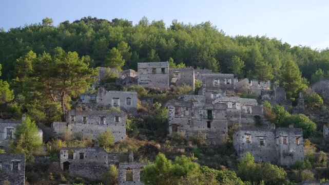 An ancient Greek village known as Kayakoy or Levissi. Historic abandoned houses. Travelling in Fethiye, Mugla province, Turkey country - 4k video 