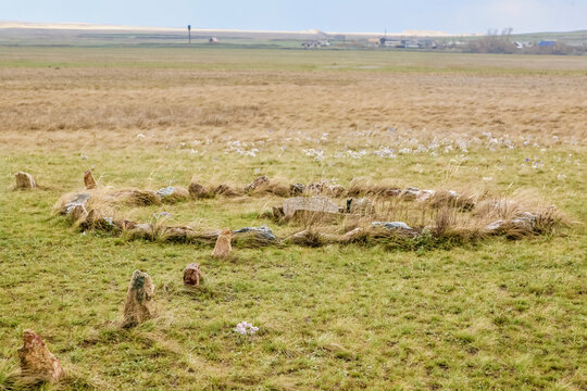 A circle of stones is in the middle of a field place of power in Arkaim Ural Russia