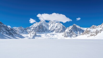 Obraz premium Snow-covered valley, majestic mountains, clear sky, winter landscape, travel poster