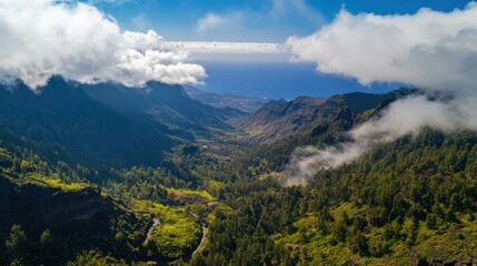Fototapeta premium Majestic Mountain Valley, Clouds Embrace Verdant Slopes
