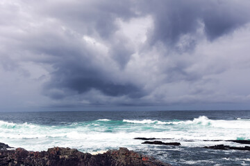 Large Indian Ocean waves and rocky coastline in Tsitsikamma, Garden Route National Park, Eastern Cape. South Africa	
