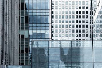 Glass skyscrapers reflecting urban skyline in London, United Kingdom.