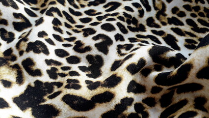 Leopard print. Lightweight natural fabric for summer clothing with an animal print. Viscose....