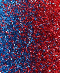 Pile of red and blue confetti creates a textured surface