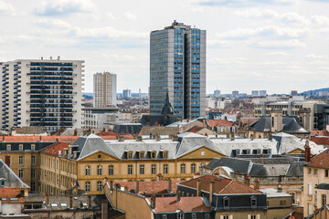 A city skyline of Nancy in France with a tall building in the middle