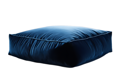A soft velvet floor cushion in a deep blue shade on a empty plain background