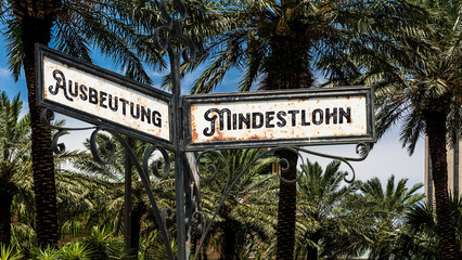 Fototapeta premium Signposts the direct way to minimum wage versus exploitation