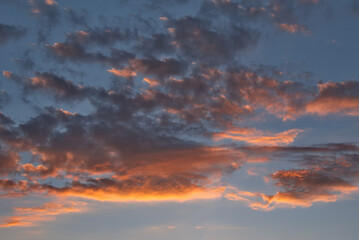 Russia. The South of Western Siberia. Panorama of the evening summer sky with multicolored clouds over the fields of Kuznetsk Alatau.