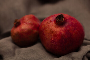 Pomegranate on canvas grey background