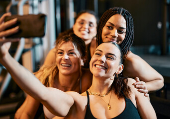 Group of Friends Taking a Smiling Selfie at the Gym Together