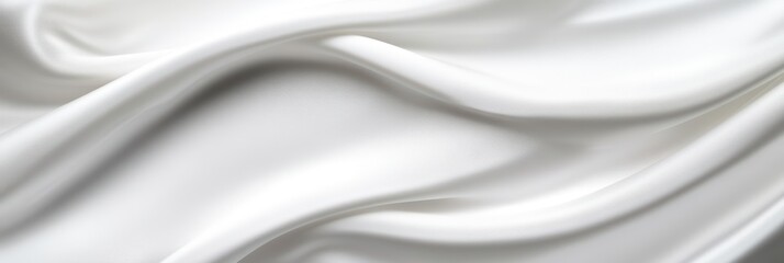 Obraz premium Elegant white silk fabric with smooth flowing folds and soft texture background