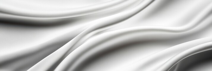 Fototapeta premium Elegant white silk fabric with smooth flowing folds and soft texture background