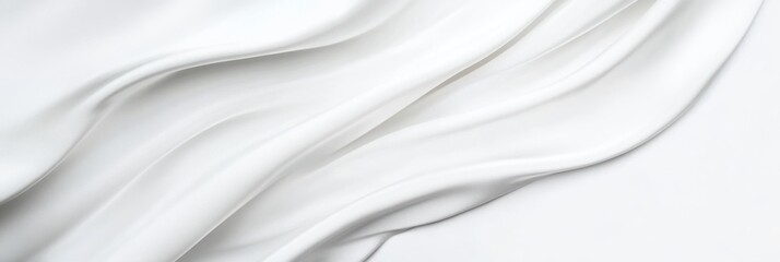 Obraz premium Elegant white silk fabric with smooth flowing folds and soft texture background