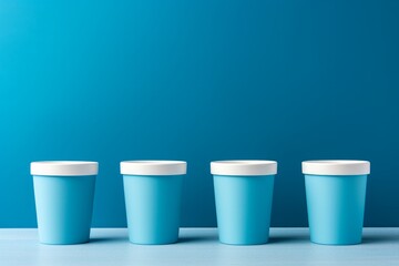 Bright blue coffee cups arranged against a serene backdrop. Generative AI