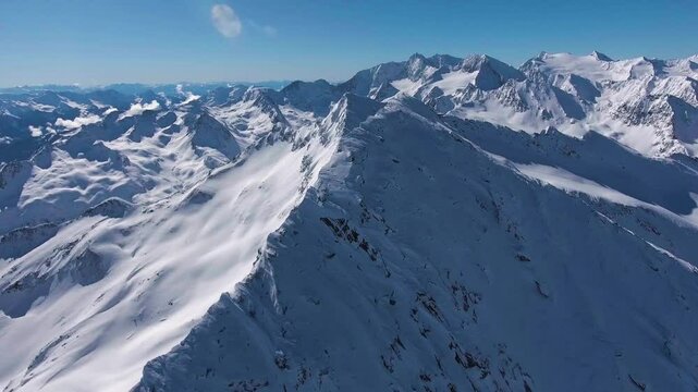 360 degree alpin winter panorama drone shot around the summit "Schermerspitze" inside the "&Ouml;tztaler Alps"