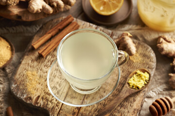 Herbal tea made of fresh ginger root with cinnamon, lemon and honey