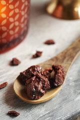 Croton lechleri, or sangre de drago resin on a wooden spoon