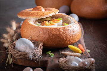 Classic sour soup in Easter bread as a bowl.