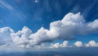 Fototapeta premium Soft White Cumulus Clouds Against a Bright Blue Sky