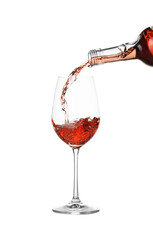 Pouring wine into glass on white background