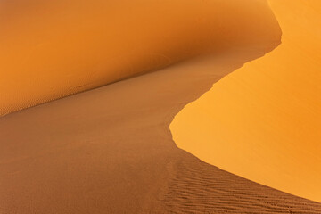 Landscape background. Curves of sand dunes. Western  Sahara closeup. Morocco. Horizontally.