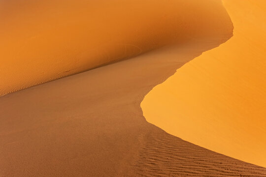 Landscape background. Curves of sand dunes. Western  Sahara closeup. Morocco. Horizontally.