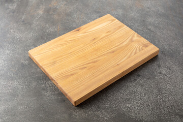 Cutting board on a kitchen table.
