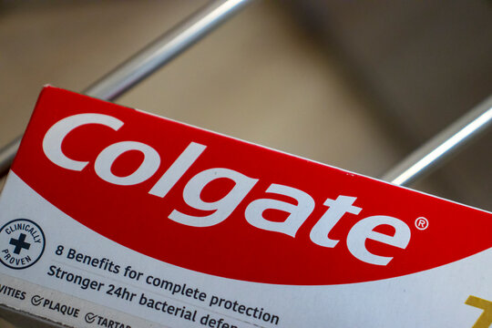 Warsaw, Poland - January 17, 2025: Close-up of Colgate toothpaste packaging, highlighting its clinical benefits and vibrant design. Ideal for health and dental care themes.