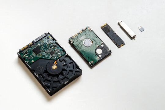 The evolution of storage devices. Several different storage media from the last 30 years, collected in one picture. From old to modern. In the photo: HDD, USB flash drive, SSD disk, flash card. 