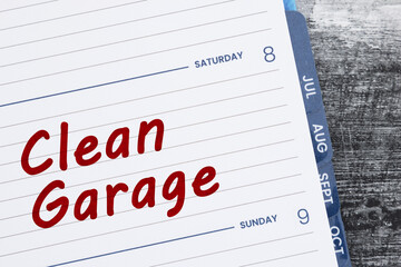 Obraz premium Clean Garage on planner of the weekend on weathered wood