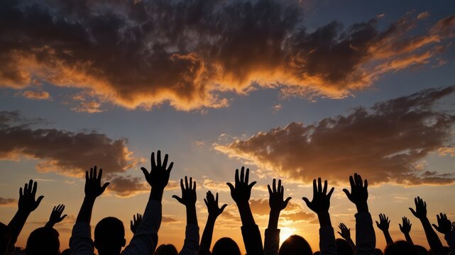Silhouetted hands reach towards a vibrant, cloud-filled sky at sunset, symbolizing hope and collective aspiration.