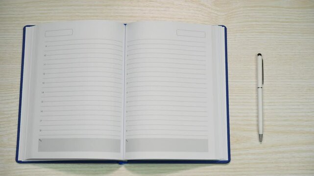 A diary with a money bookmark opens to a blank page and closes and walks away. Stop motion animation