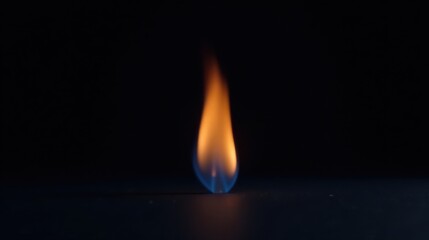 A Single Flame Flickers in the Dark, a Study in Light and Shadow, a Visual Representation of Burning Energy