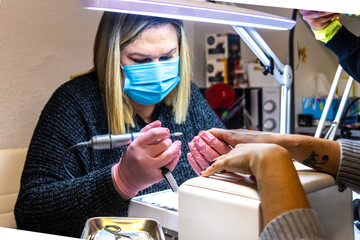 Manicure session in progress at a nail salon